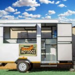 Customizable mobile food trailer equipped with gas stoves, fryers, water dispensers, sinks, serving hatches, and vents.