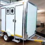 Luxury VIP mobile toilet with modern amenities, including sinks, mirrors, and comfortable interiors.
